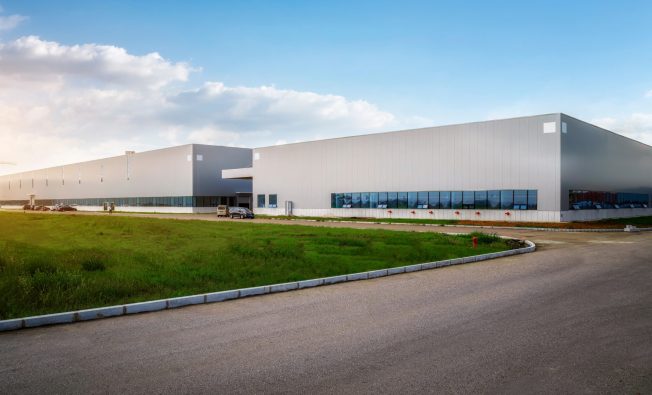 Modern,Industrial,Warehouse,At,Sunset,With,Clear,Sky